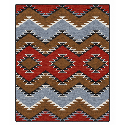 Crossplay area rug: a rectangular area rug with a Southwestern geometric pattern featuring red, brown, light blue, black, and white zigzags and diamonds.
