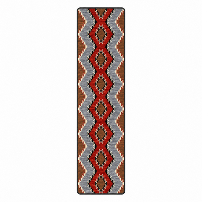 Crossplay area rug: a rectangular area rug with a Southwestern geometric pattern featuring red, brown, slate blue, black, and cream zigzags and diamonds.