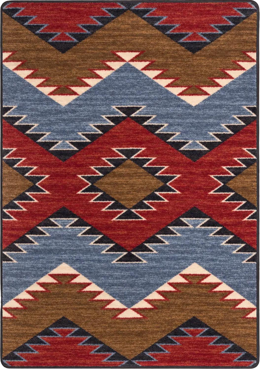 A square area rug with a Southwestern geometric pattern featuring red, blue, brown, black, and cream zigzags and diamonds.
