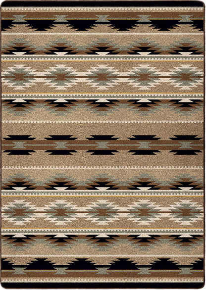 Field Notes area rug: a rectangular area rug with a Southwestern geometric pattern featuring horizontal bands of black, brown, beige, and muted blue-gray.