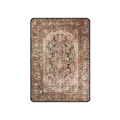 A rectangular vintage-style area rug with an ornate traditional pattern in muted beige, red, brown, and black tones, shown flat against a solid white background.