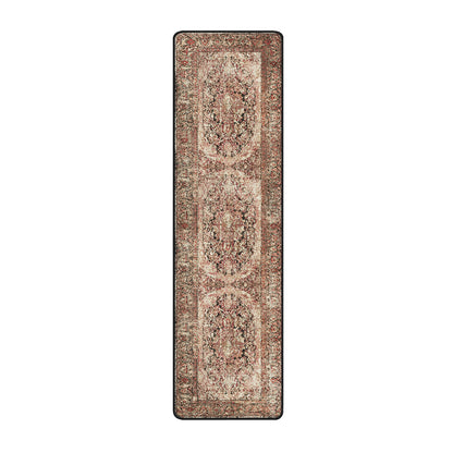 A long rectangular runner rug with an ornate traditional pattern in muted beige, rust red, brown, and black, shown flat against a solid white background.