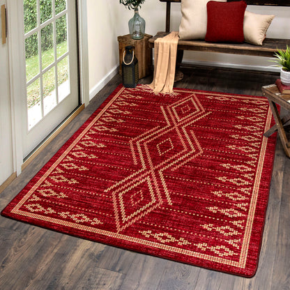 Red patterned rug on a wooden floor with a bench and decor items in the background.