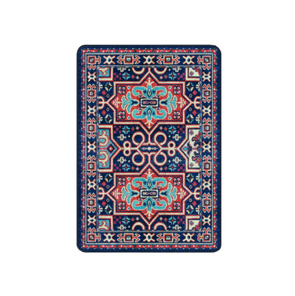 A rectangular area rug with a traditional ornamental pattern, featuring a dark navy blue base with red, turquoise, and cream geometric and floral motifs.