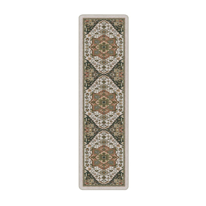 A long rectangular area rug with an ornate repeating geometric and floral medallion pattern in beige, brown, olive green, black, and cream tones.